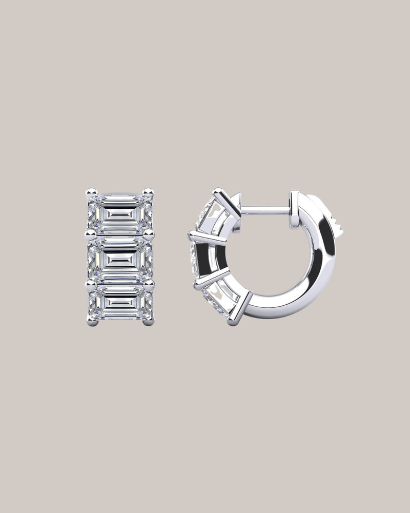 Lab grown emerald cut diamond huggie earrings with three diamonds per hoop in 14K white gold