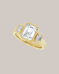 Emerald cut three stone engagement ring with 1.75 ct lab grown centre diamond and emerald cut side diamonds