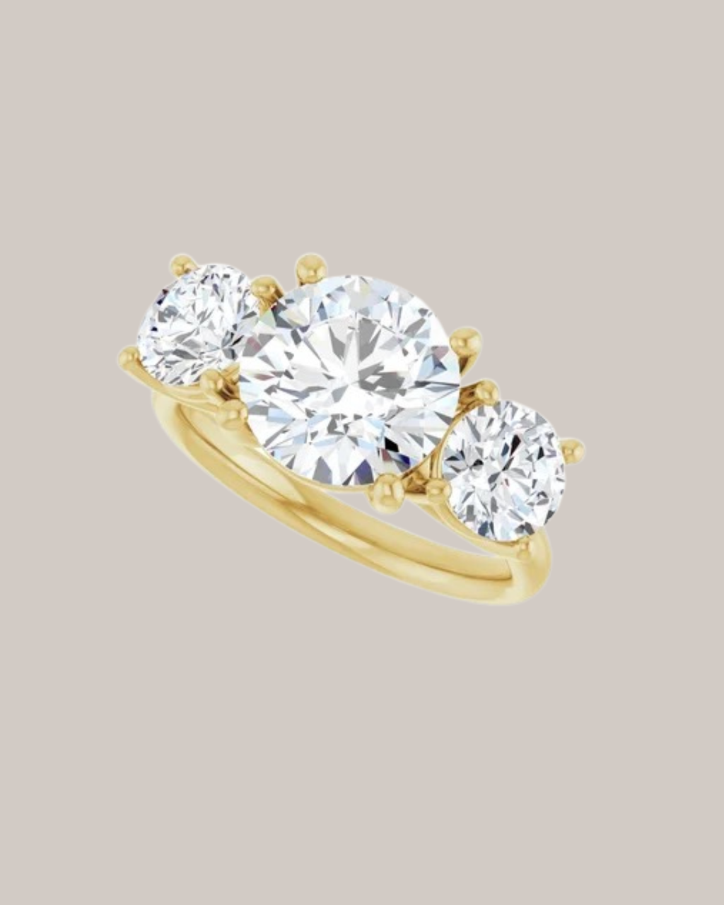 Round three stone engagement ring in 14K yellow gold with 2.00 ct centre diamond and 1.50 ctw lab grown diamond side stones