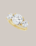 Round three stone engagement ring in 14K yellow gold with 2.00 ct centre diamond and 1.50 ctw lab grown diamond side stones