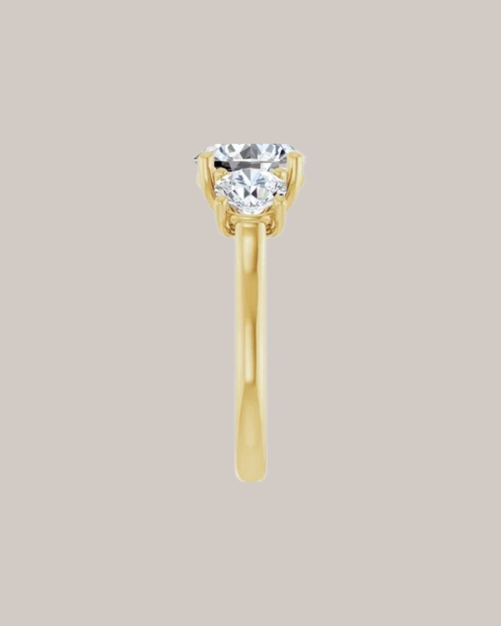 Round three stone engagement ring in 14K yellow gold with 2.00 ct centre diamond and 1.50 ctw lab grown diamond side stones
