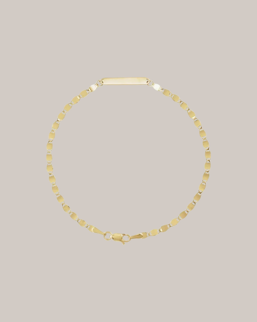 Engravable 14K yellow gold bracelet with polished centre plate 
