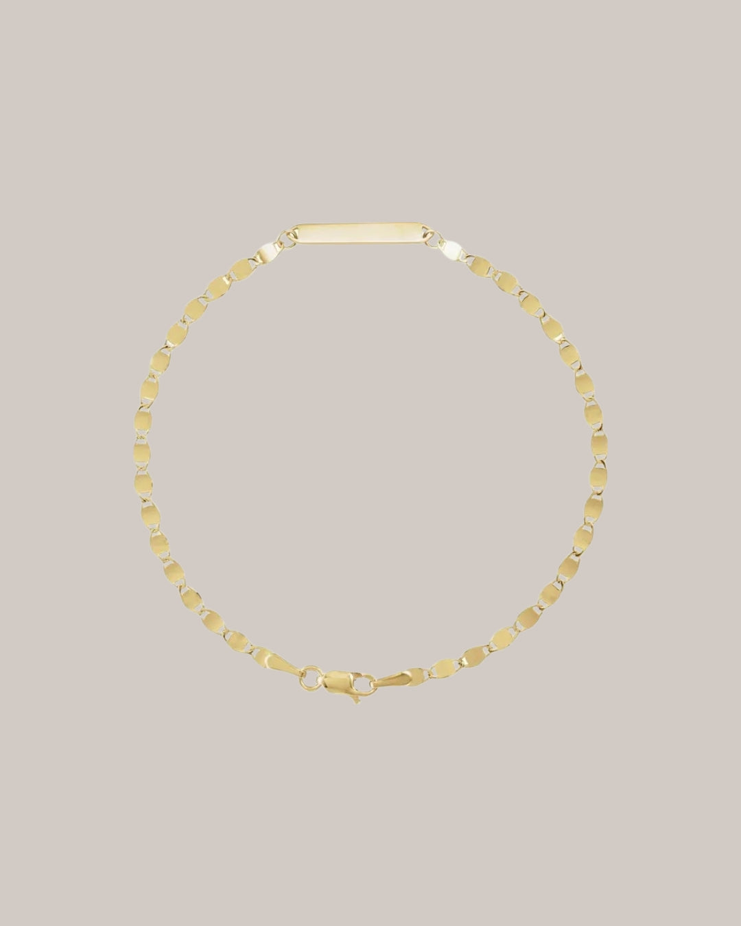 Engravable 14K yellow gold bracelet with polished centre plate 
