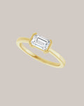 Emerald East West Solitaire Ring