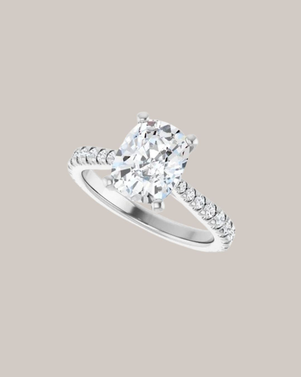Elongated cushion engagement ring with lab grown diamond accents in white gold