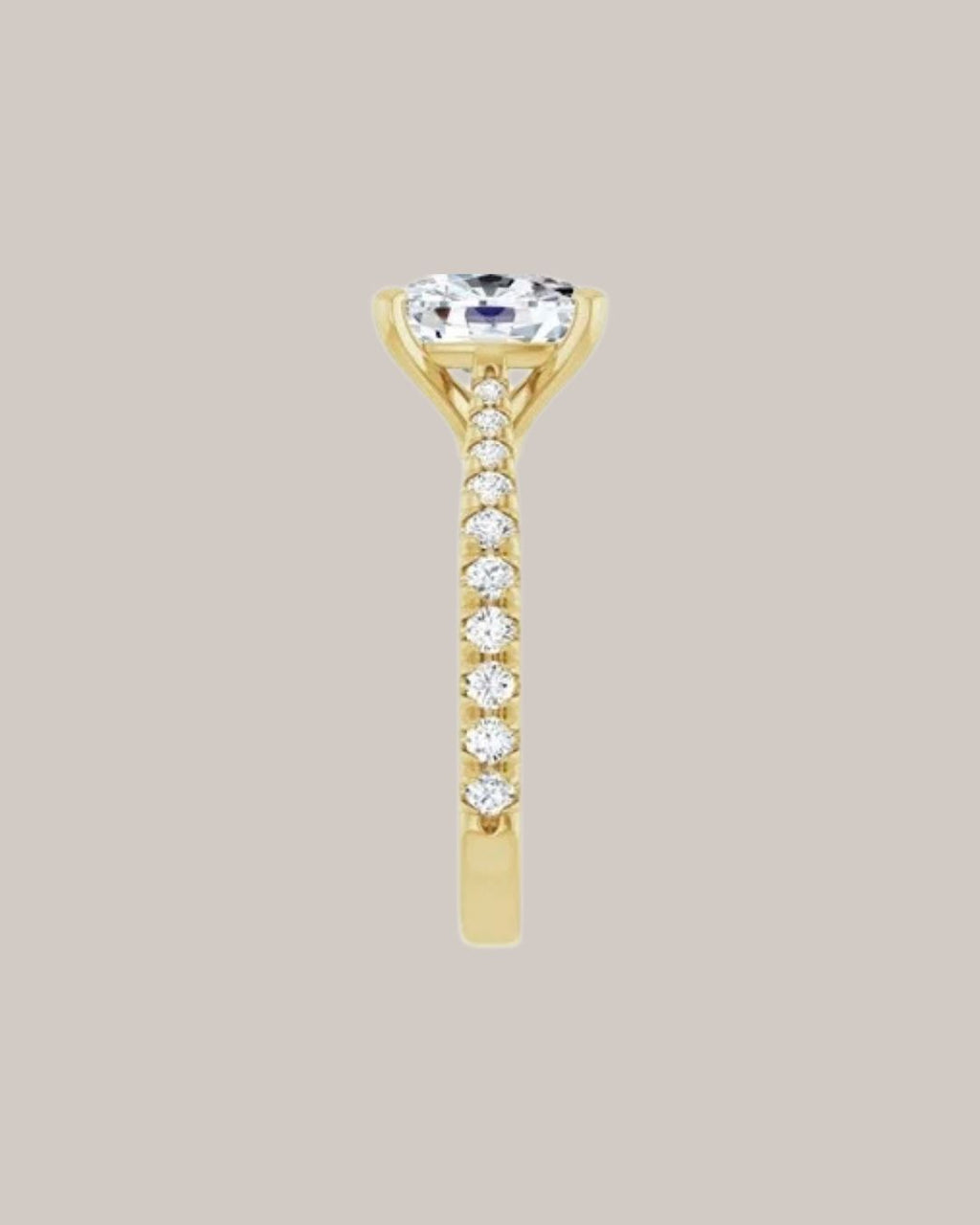 Elongated cushion engagement ring with lab grown diamond accents in yellow gold side view