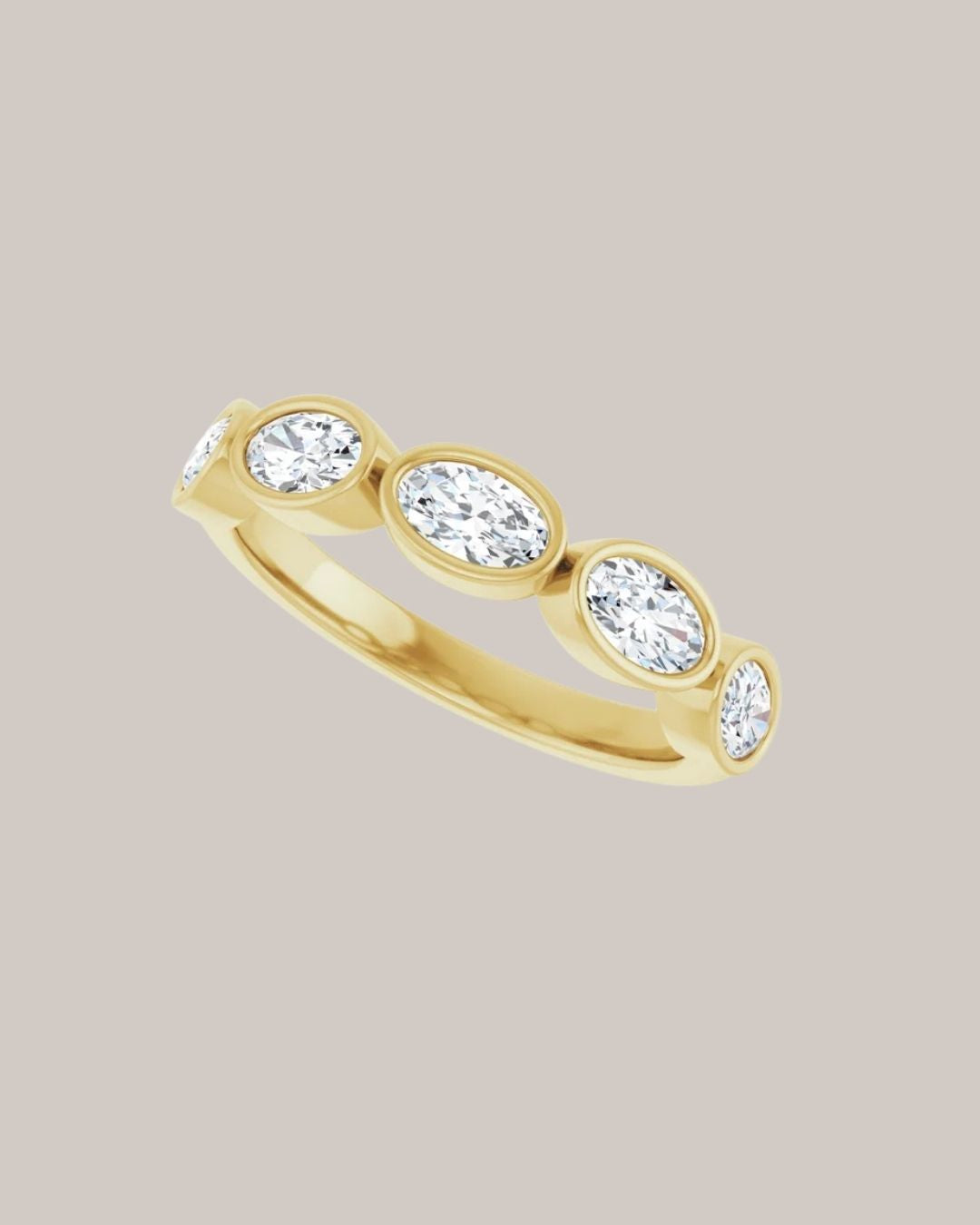 Five stone oval bezel diamond band in 14K yellow gold