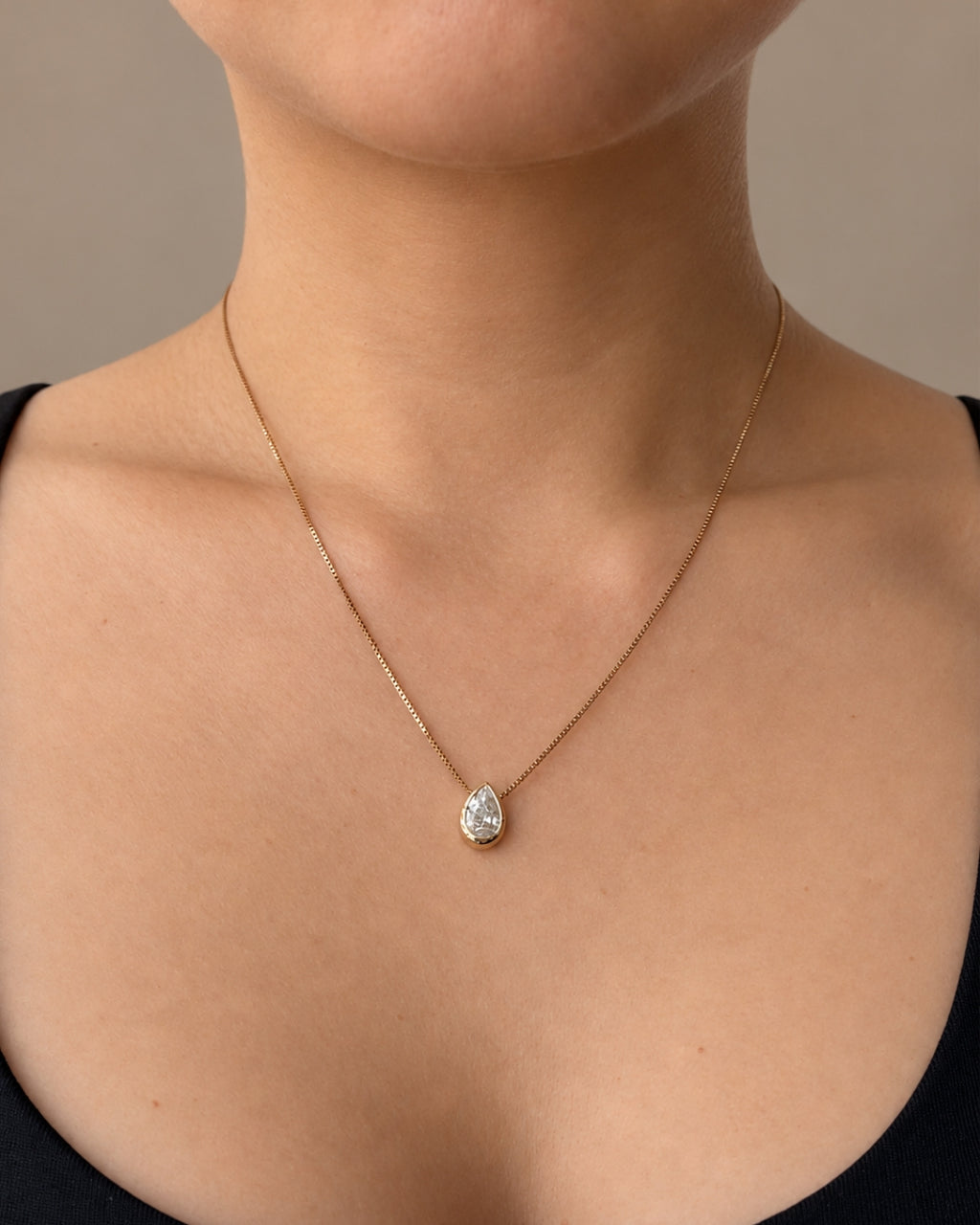 0.91 ct natural pear diamond bezel pendant in 14K yellow gold