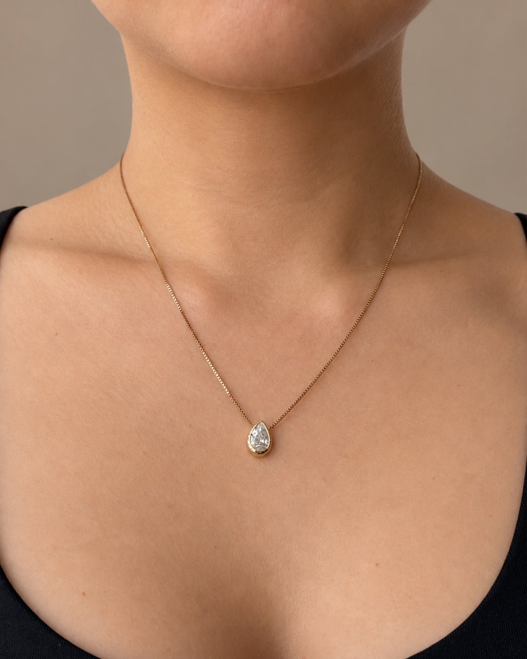 0.91 ct natural pear diamond bezel pendant in 14K yellow gold