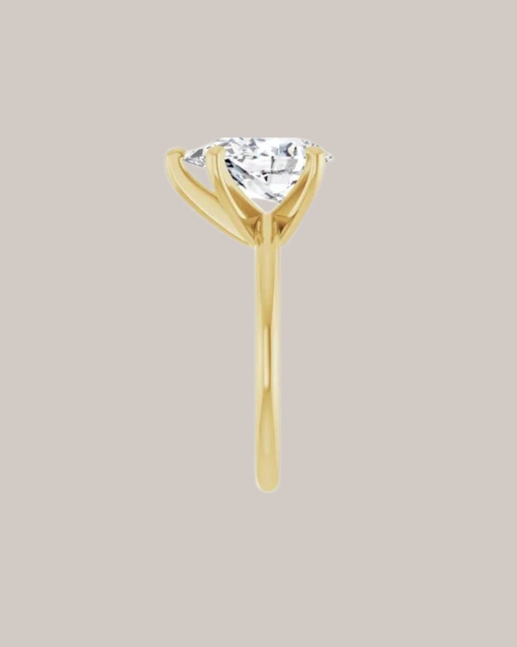 Pear solitaire engagement ring setting in 14K yellow gold shown with a 3.00 ct pear centre diamond