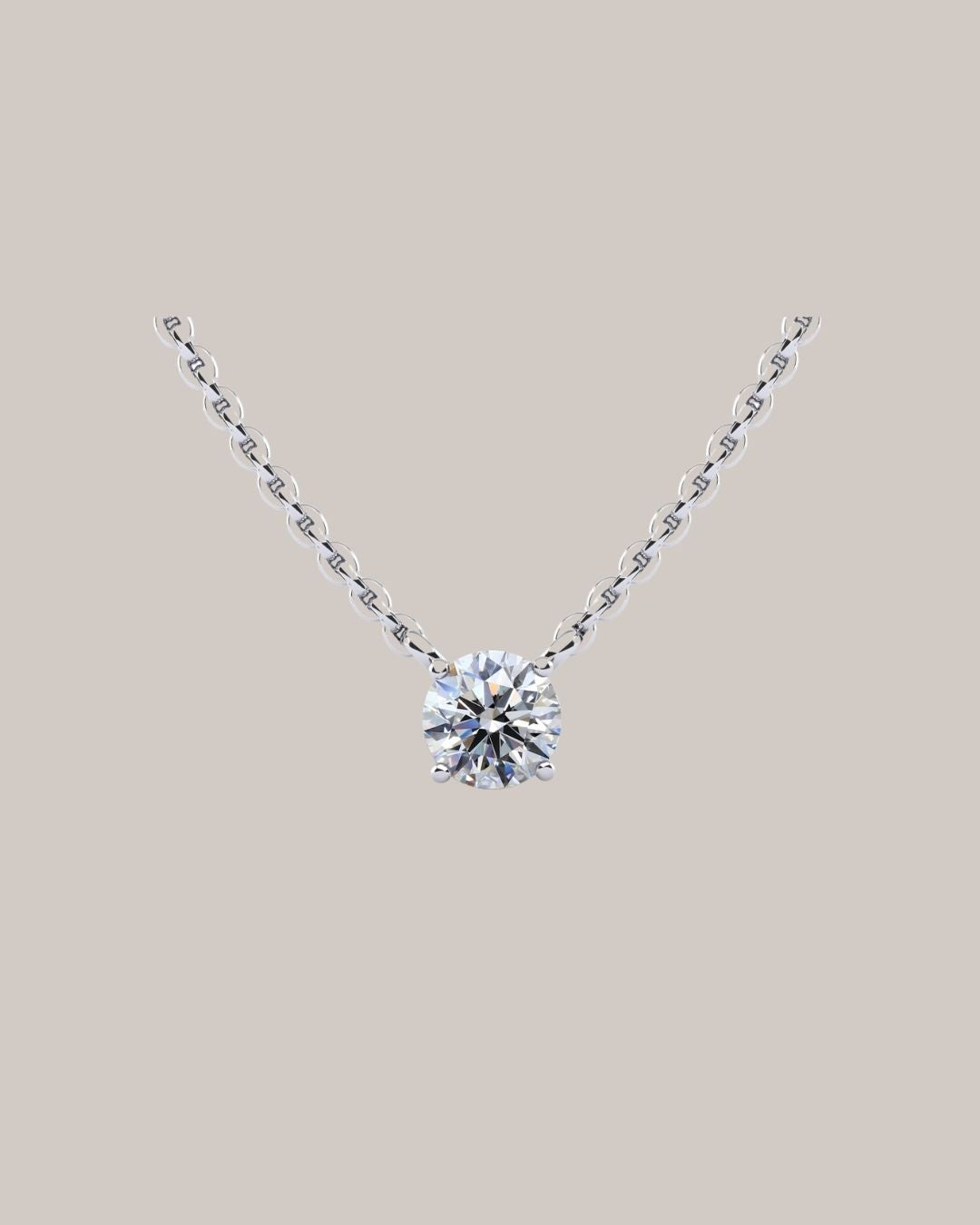 White gold 1.00 ct round diamond solitaire pendant on an 18 inch cable chain