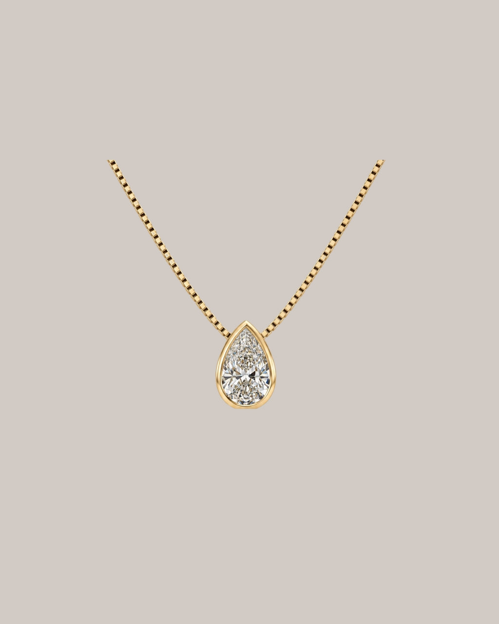 0.91 ct natural pear diamond bezel pendant in 14K yellow gold