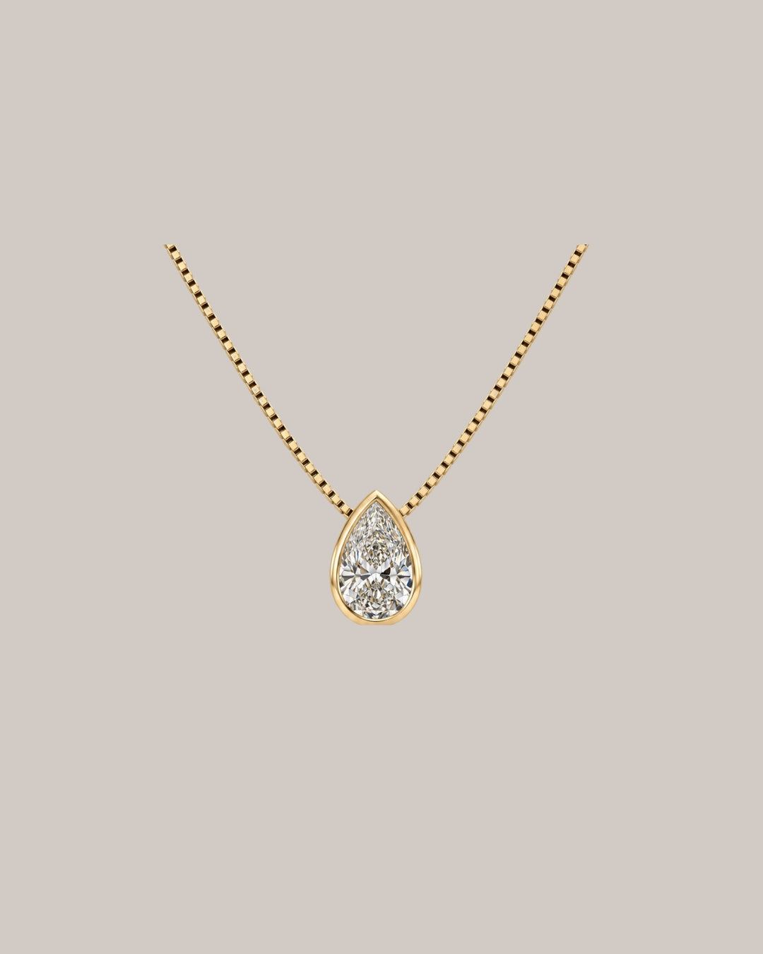 0.91 ct natural pear diamond bezel pendant in 14K yellow gold