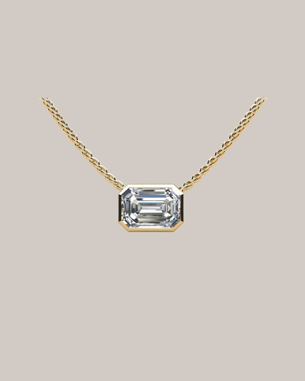 Yellow gold 1.00 ct emerald cut diamond solitaire pendant on an 18 inch cable chain
