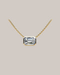 Yellow gold 1.00 ct emerald cut diamond solitaire pendant on an 18 inch cable chain
