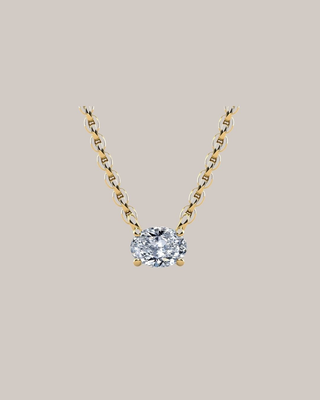 Yellow gold 1.00 ct east west oval diamond pendant on an 18 inch cable chain
