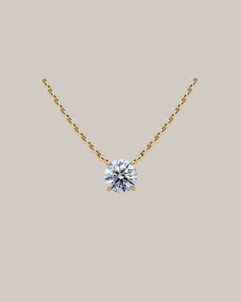 Yellow gold  1.00 ct round diamond solitaire pendant on an 18 inch cable chain
