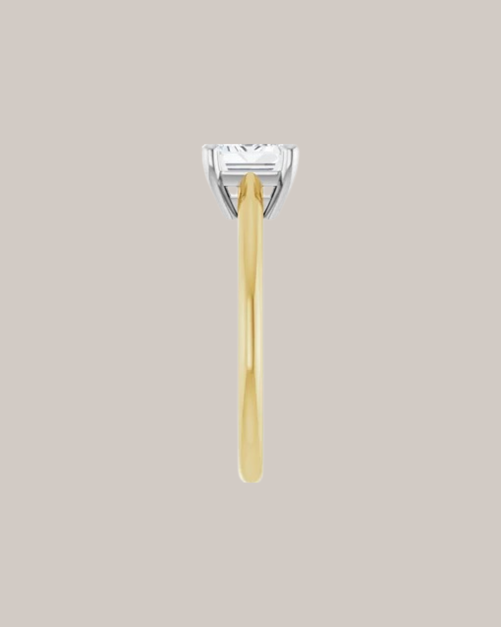 Two tone east west emerald cut solitaire engagement ring in 14K gold shown with a 1.75 ct centre diamond