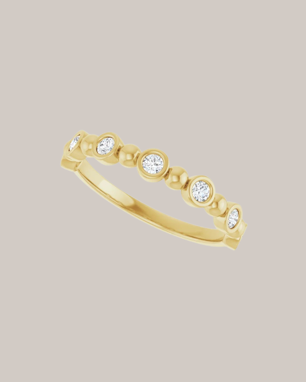 Bezel and bead diamond band with 7 lab grown round diamonds totaling 0.20 ctw in 14K yellow gold
